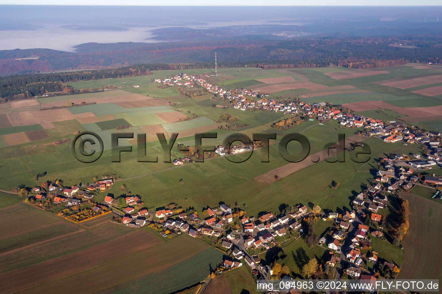 Village - view on the edge of agricultural fields and farmland in Wuerzberg in the state Hesse, Germany