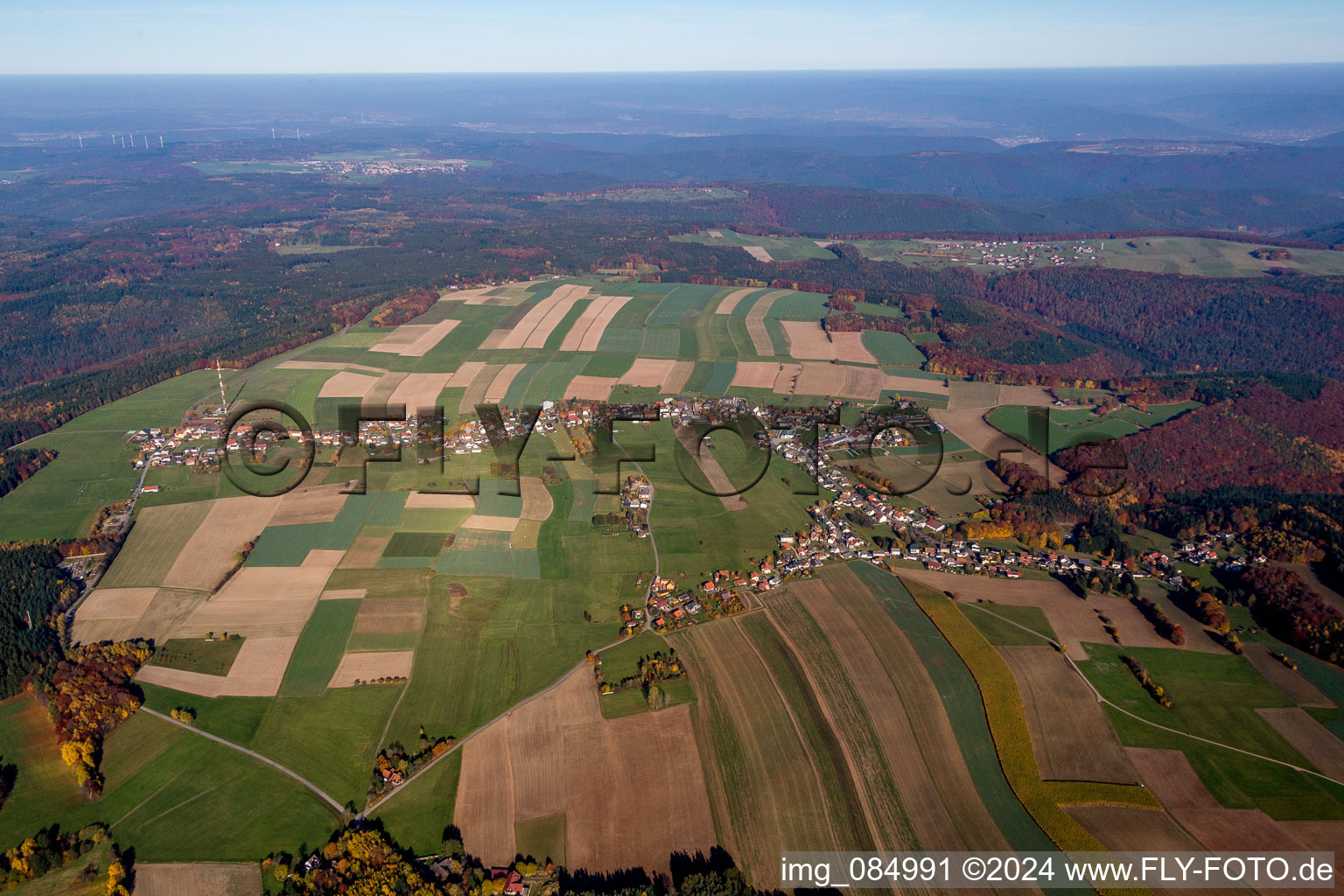 Aerial view of Village - view on the edge of agricultural fields and farmland in Wuerzberg in the state Hesse, Germany