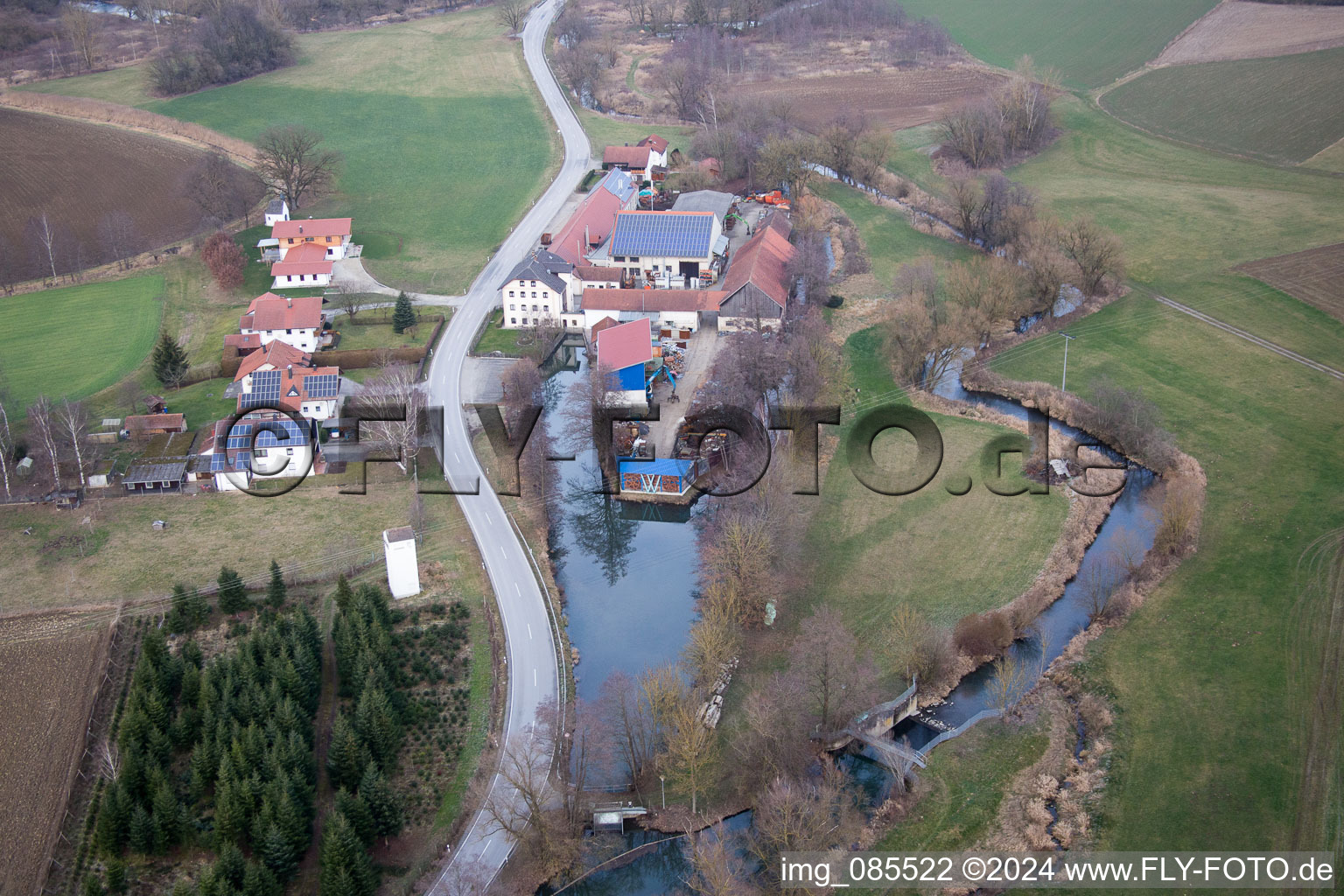 Historic windmill on a farm homestead on the edge of cultivated fields in the district Anzenkirchen in Triftern in the state Bavaria