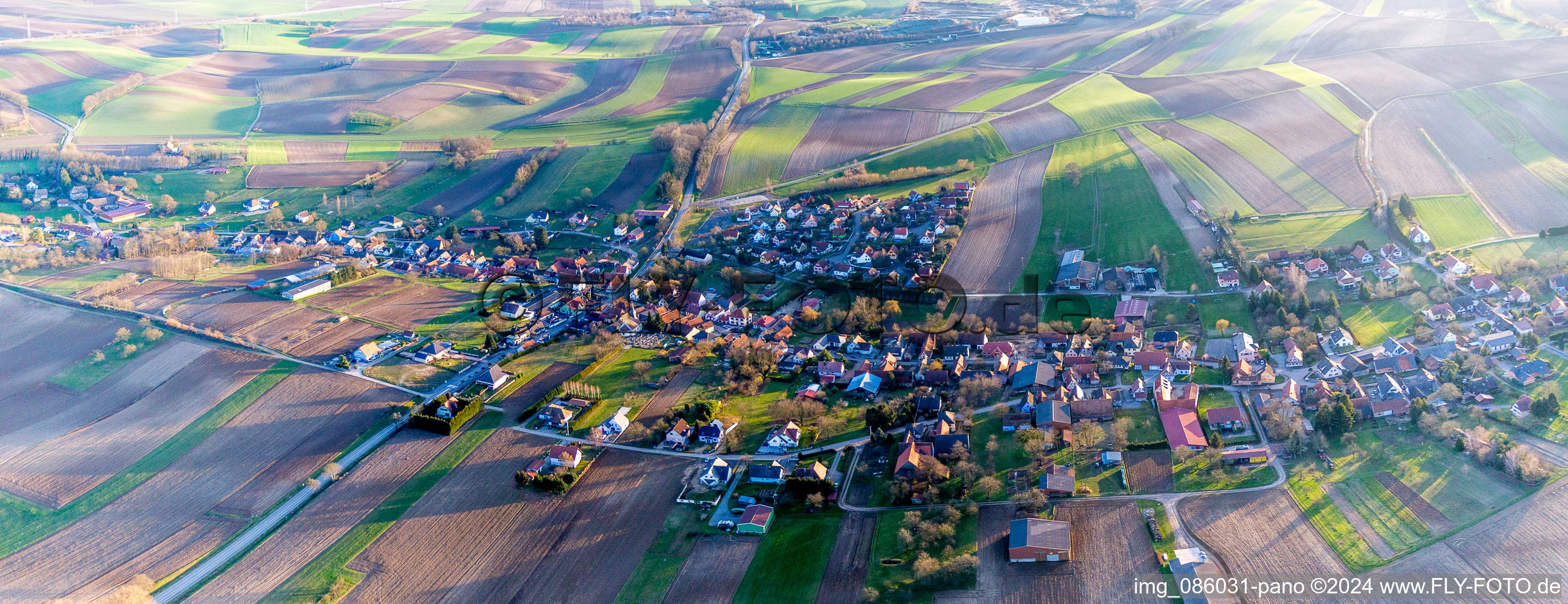 Village - view on the edge of agricultural fields and farmland in Wintzenbach in Grand Est, France