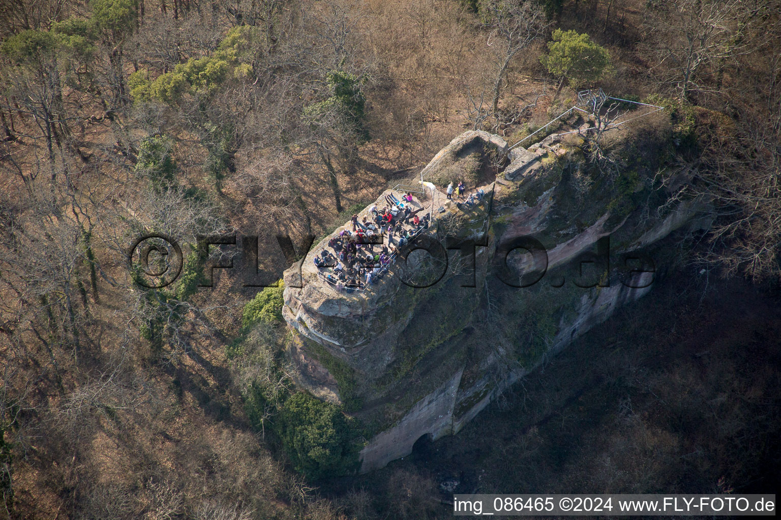 Hikers on the Ruins and vestiges of the former castle and fortress Neukastel in Leinsweiler in the state Rhineland-Palatinate