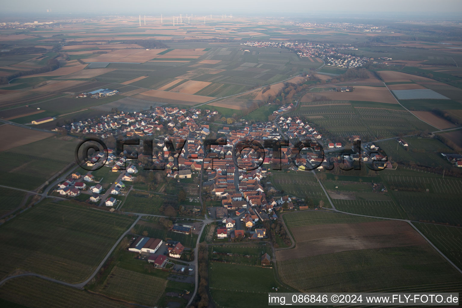 Village - view on the edge of agricultural fields and farmland in Impflingen in the state Rhineland-Palatinate, Germany