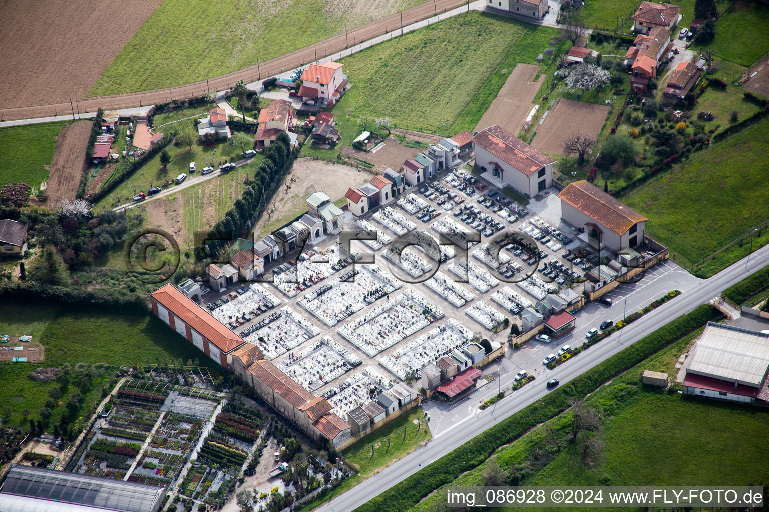 Grave rows on the grounds of the cemetery in Strettoia in Toskana, Italy