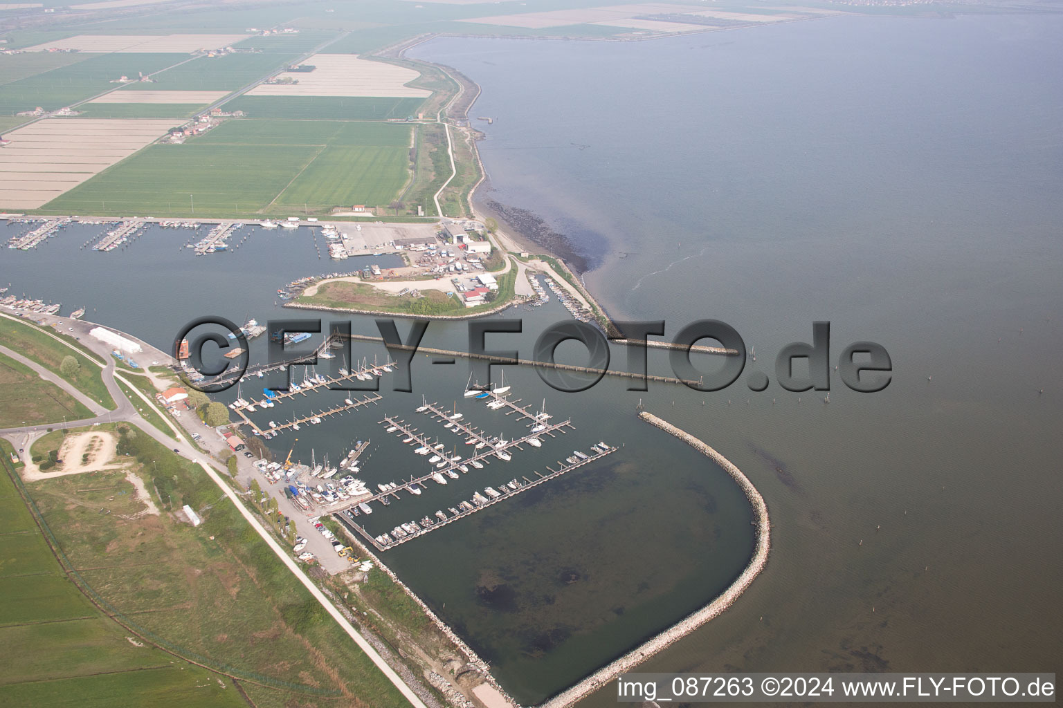 Pleasure boat marina with docks and moorings on the shore area der Adria in Goro in Emilia-Romagna, Italy