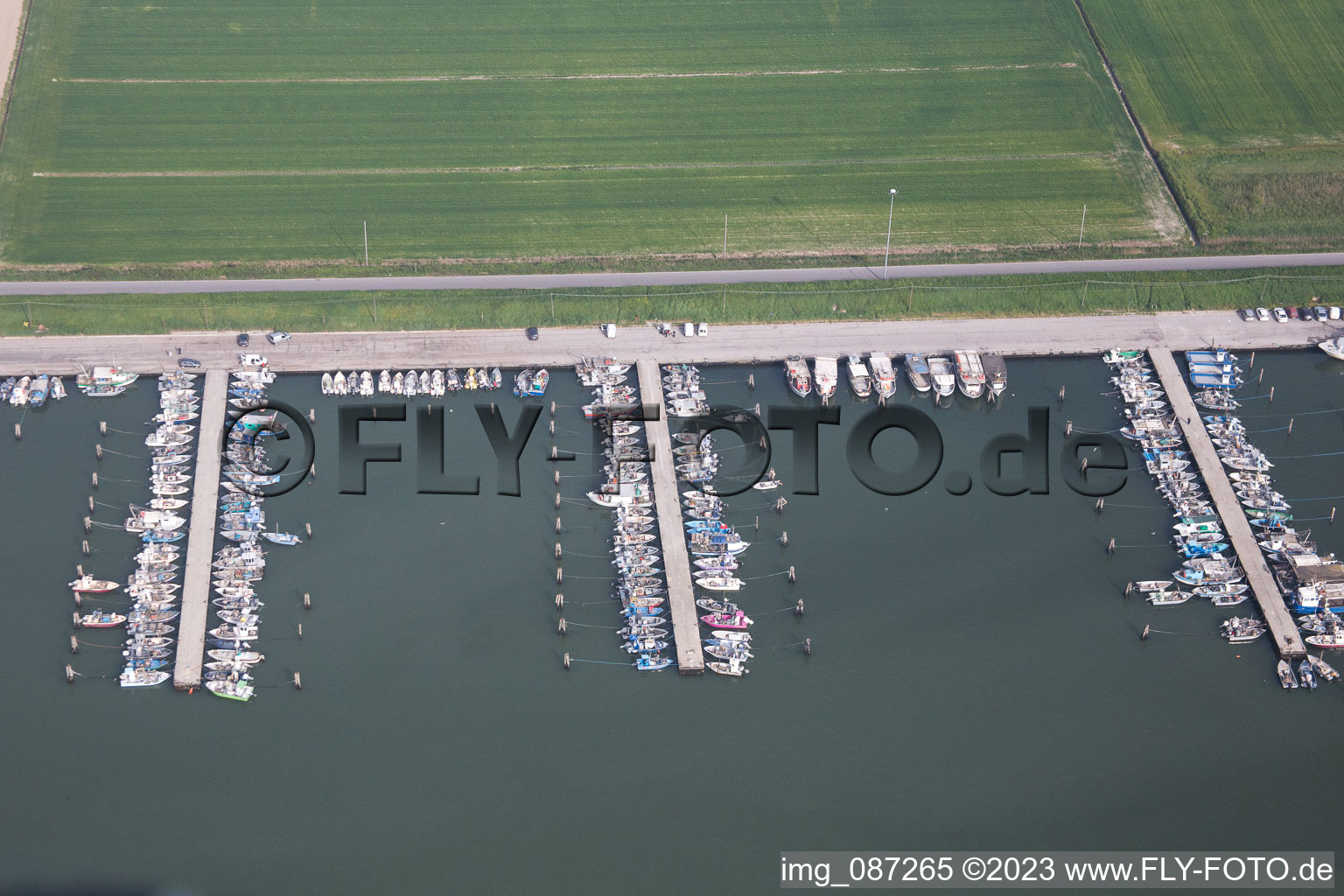 Aerial photograpy of Pleasure boat marina with docks and moorings on the shore area der Adria in Goro in Emilia-Romagna, Italy