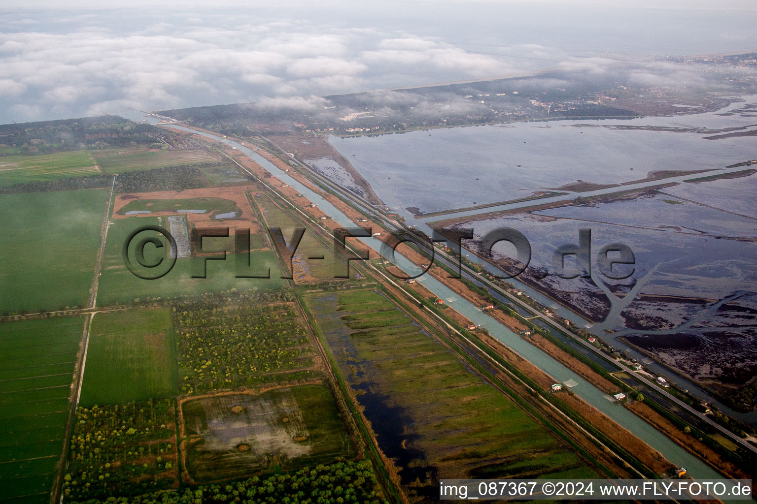 Channel flow and river banks of the waterway shipping Fiume Lamone in Marina Romea in Emilia-Romagna, Italy