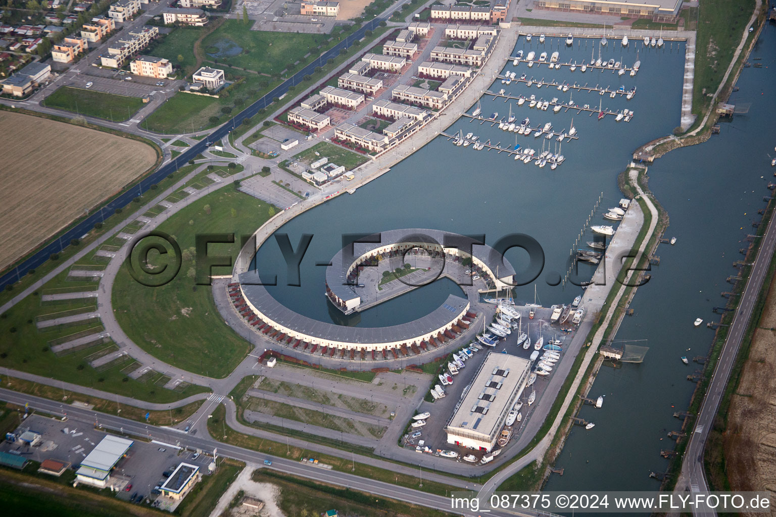 Aerial photograpy of Pleasure boat marina with docks and moorings on the shore area Marina di Porto Reno in Casalborsetti in Emilia-Romagna, Italy