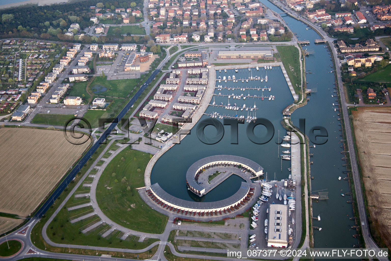 Oblique view of Pleasure boat marina with docks and moorings on the shore area Marina di Porto Reno in Casalborsetti in Emilia-Romagna, Italy