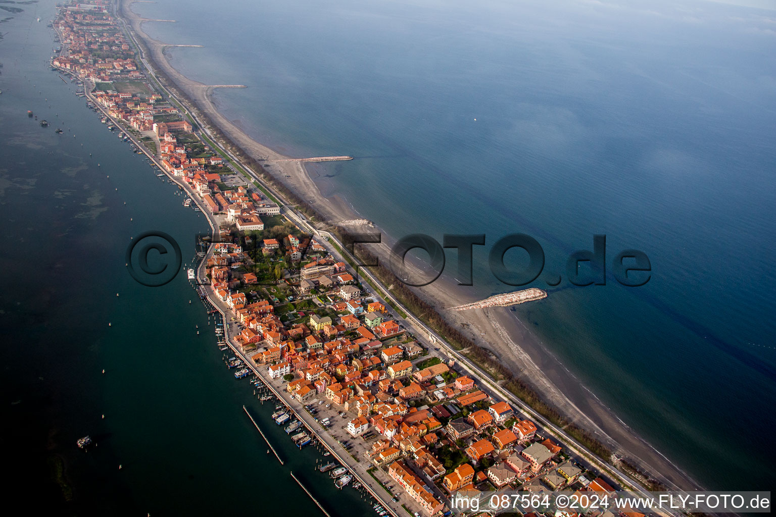 Townscape on the seacoast of Mediterranean Sea in San Vito in Veneto, Italy from the drone perspective