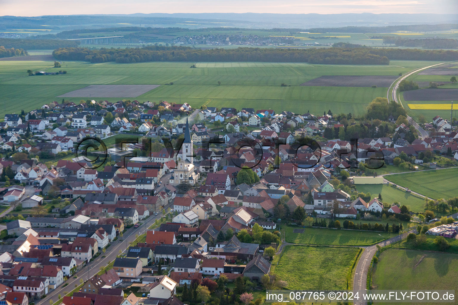 Aerial view of Village - view on the edge of agricultural fields and farmland in Grettstadt in the state Bavaria, Germany