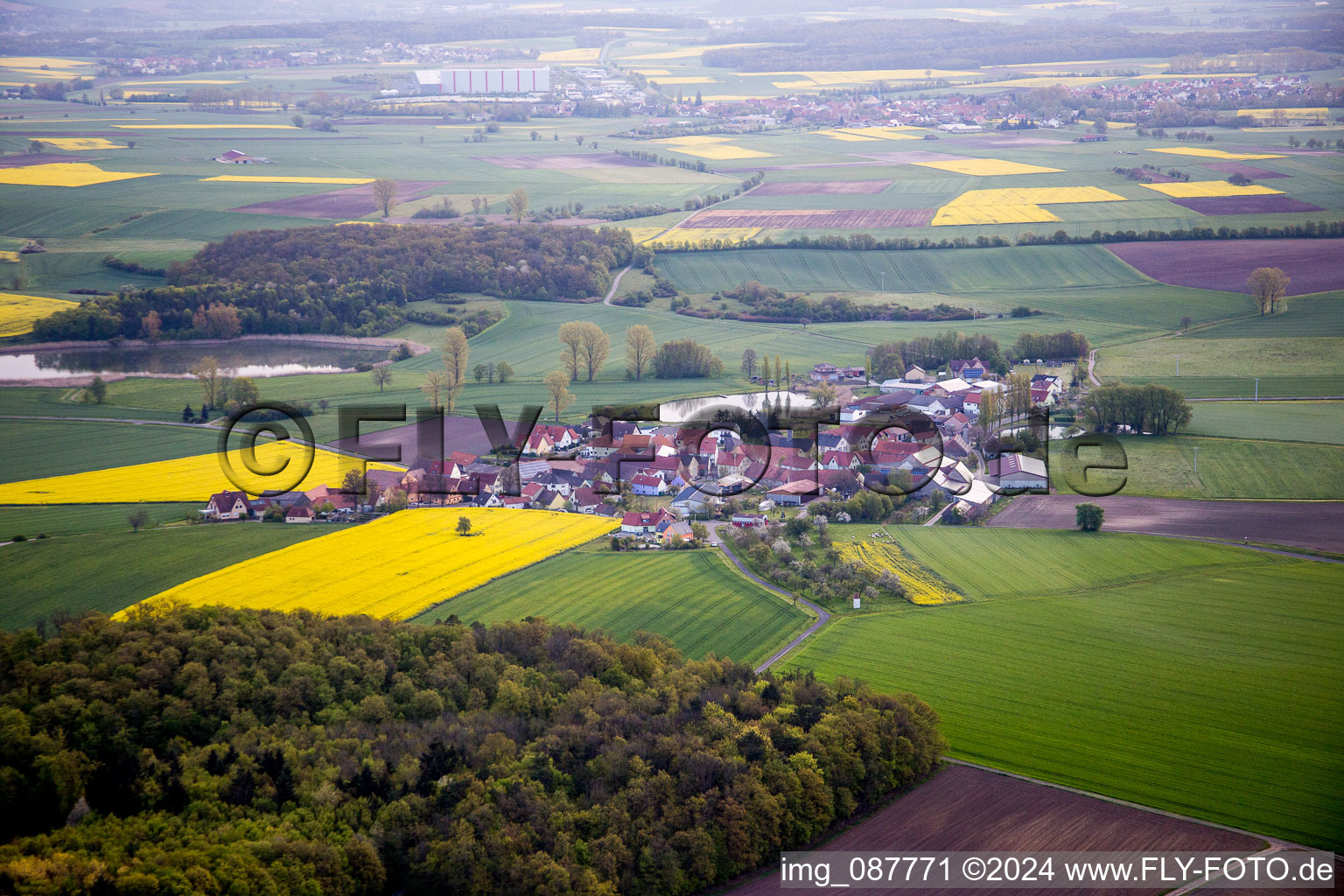 Village - view on the edge of agricultural fields and farmland in the district Kleinrheinfeld in Donnersdorf in the state Bavaria, Germany