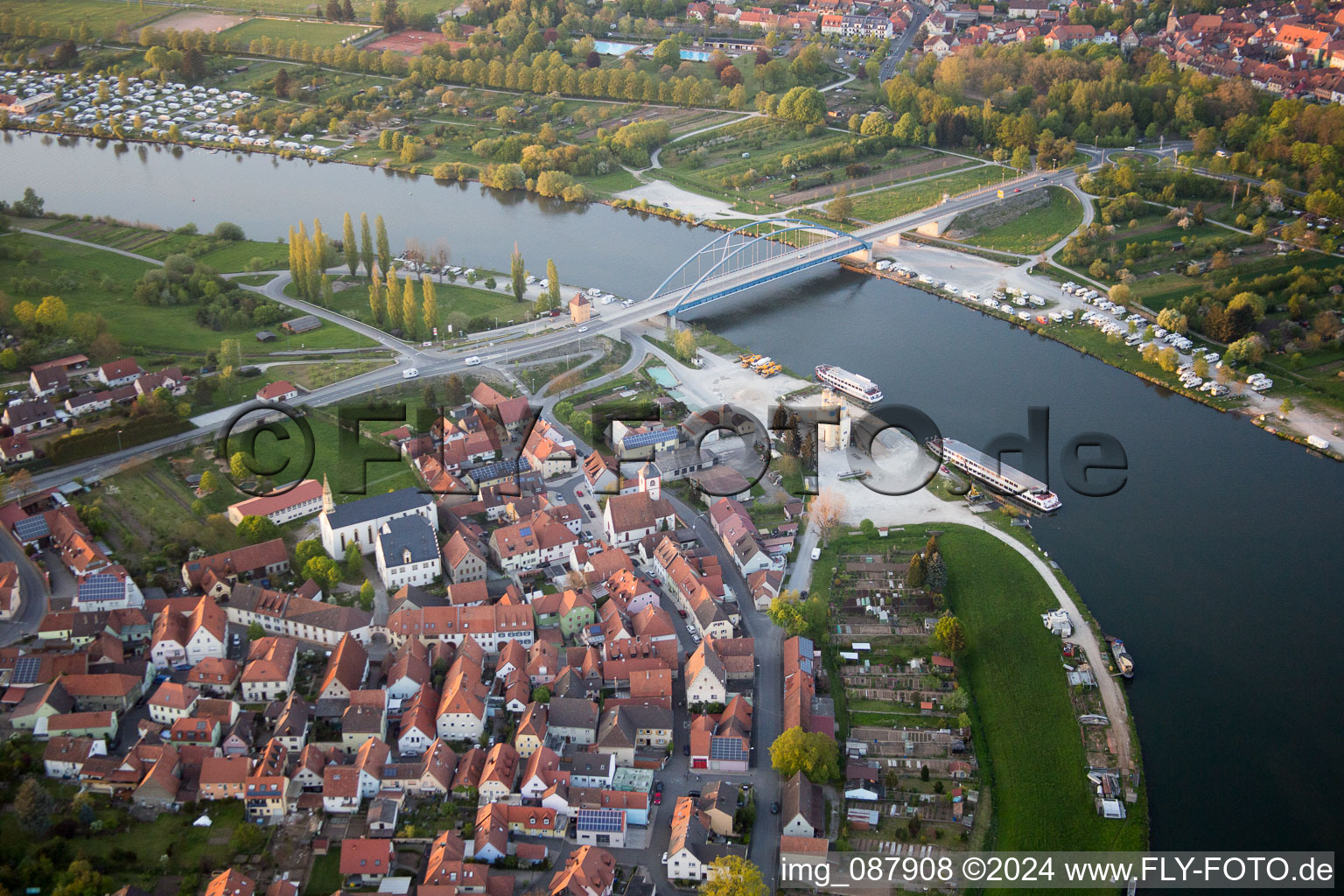 Pier with excursion boats on the Main in front of the Main Bridge Volkach in the district Astheim in Volkach in the state Bavaria, Germany