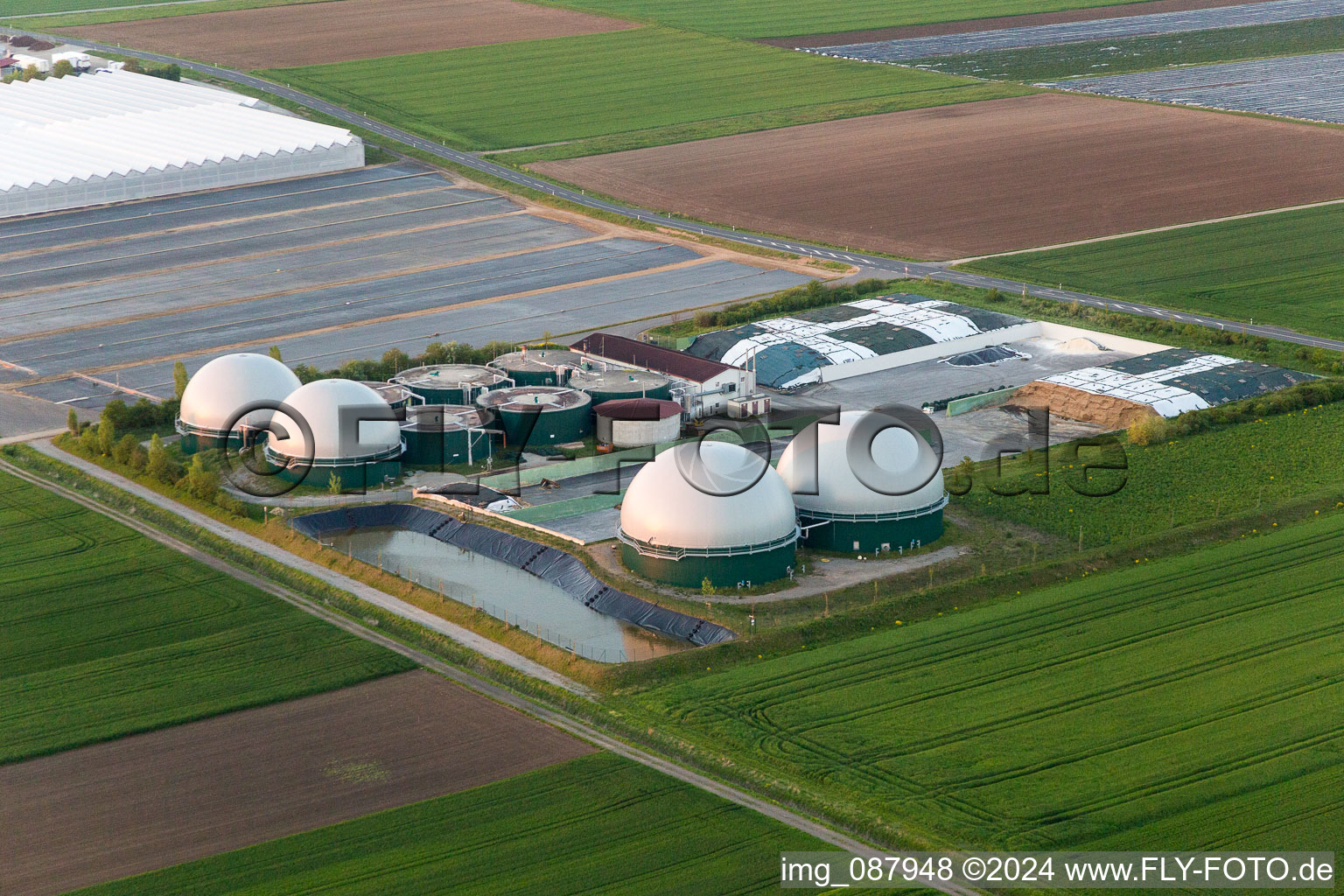 Aerial view of Glass roof surfaces in the greenhouse rows for Floriculture in the district Oberspiesheim in Kolitzheim in the state Bavaria, Germany