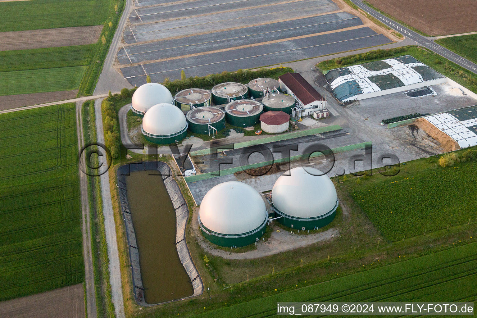 Aerial photograpy of Glass roof surfaces in the greenhouse rows for Floriculture in the district Oberspiesheim in Kolitzheim in the state Bavaria, Germany