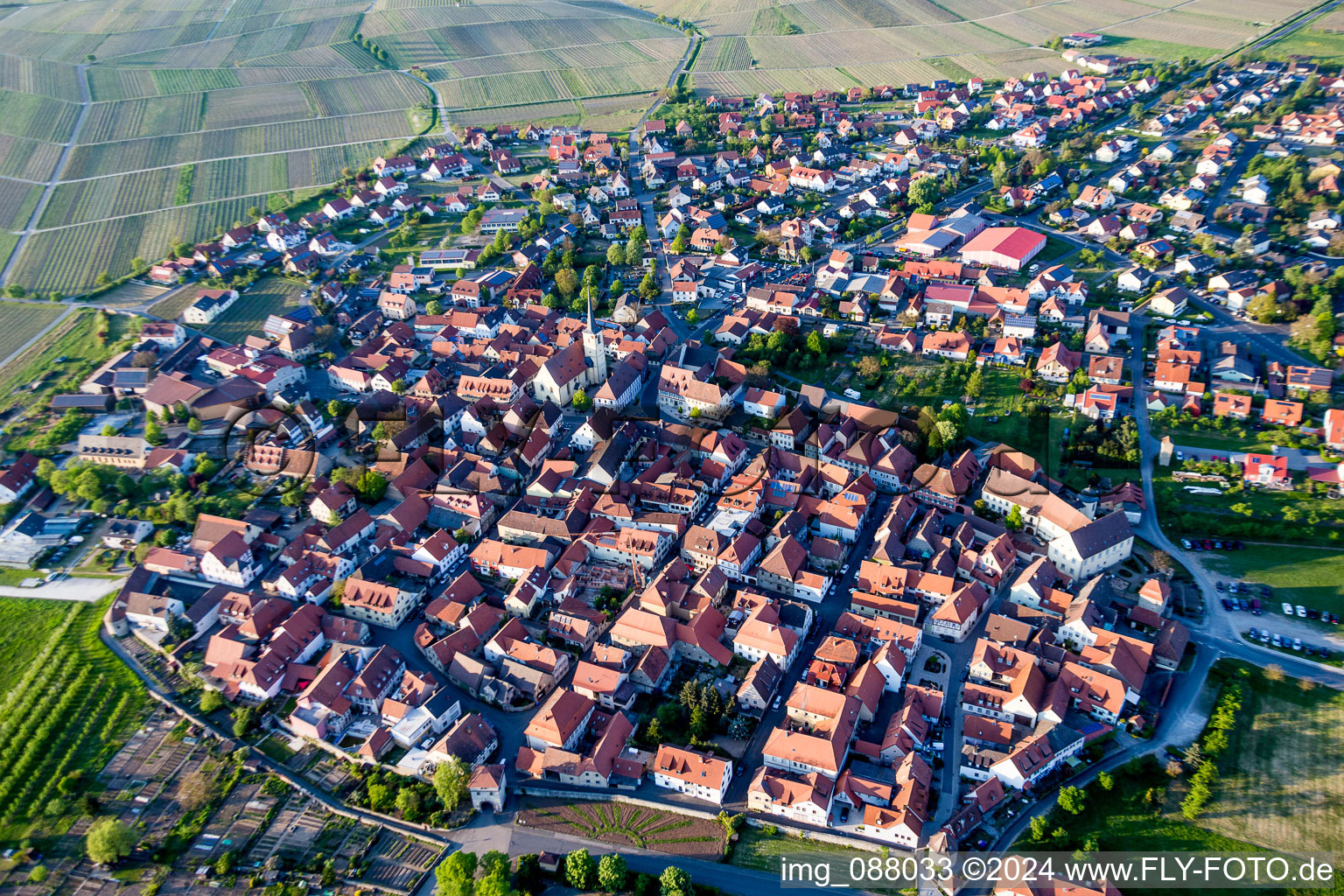 Village - view on the edge of agricultural fields and farmland in Sommerach in the state Bavaria, Germany