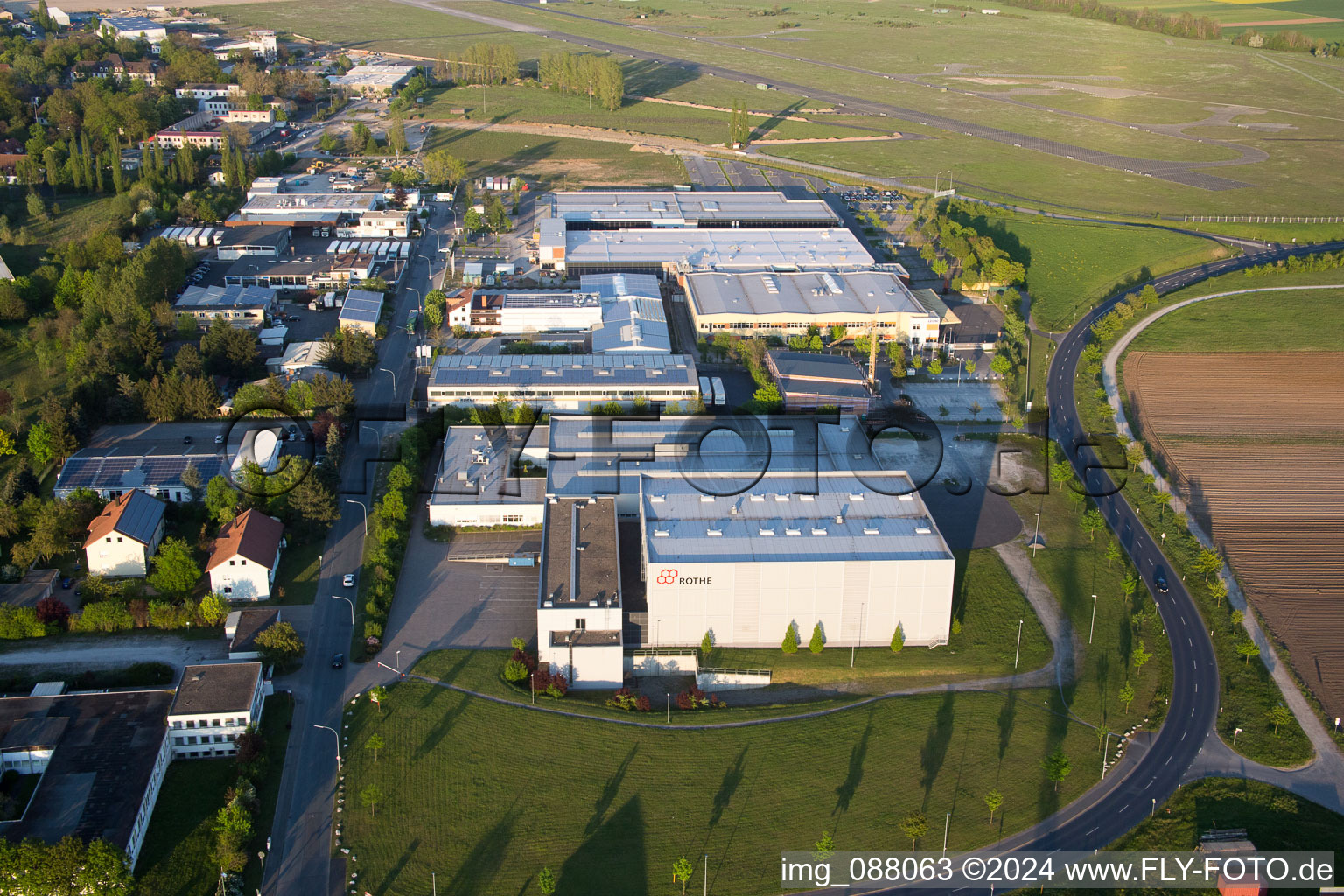 Aerial view of Industrial estate and company settlement Flugplatzstrasse in the district Etwashausen in Kitzingen in the state Bavaria, Germany