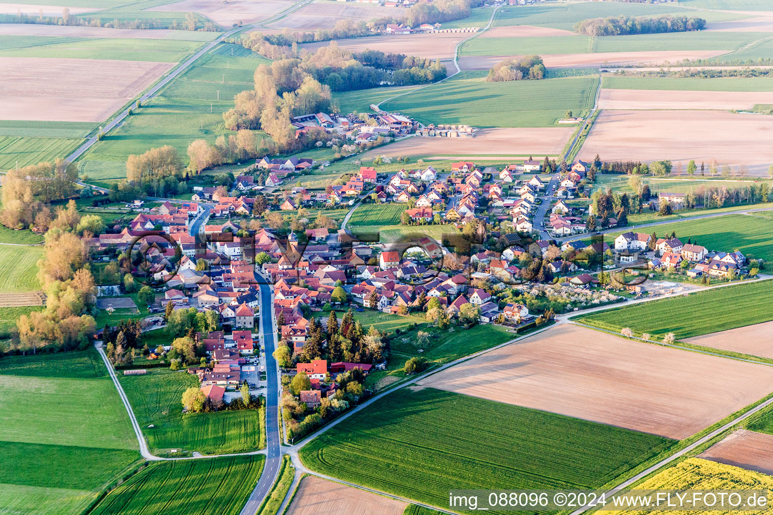 Village - view on the edge of agricultural fields and farmland in Reupelsdorf in the state Bavaria, Germany