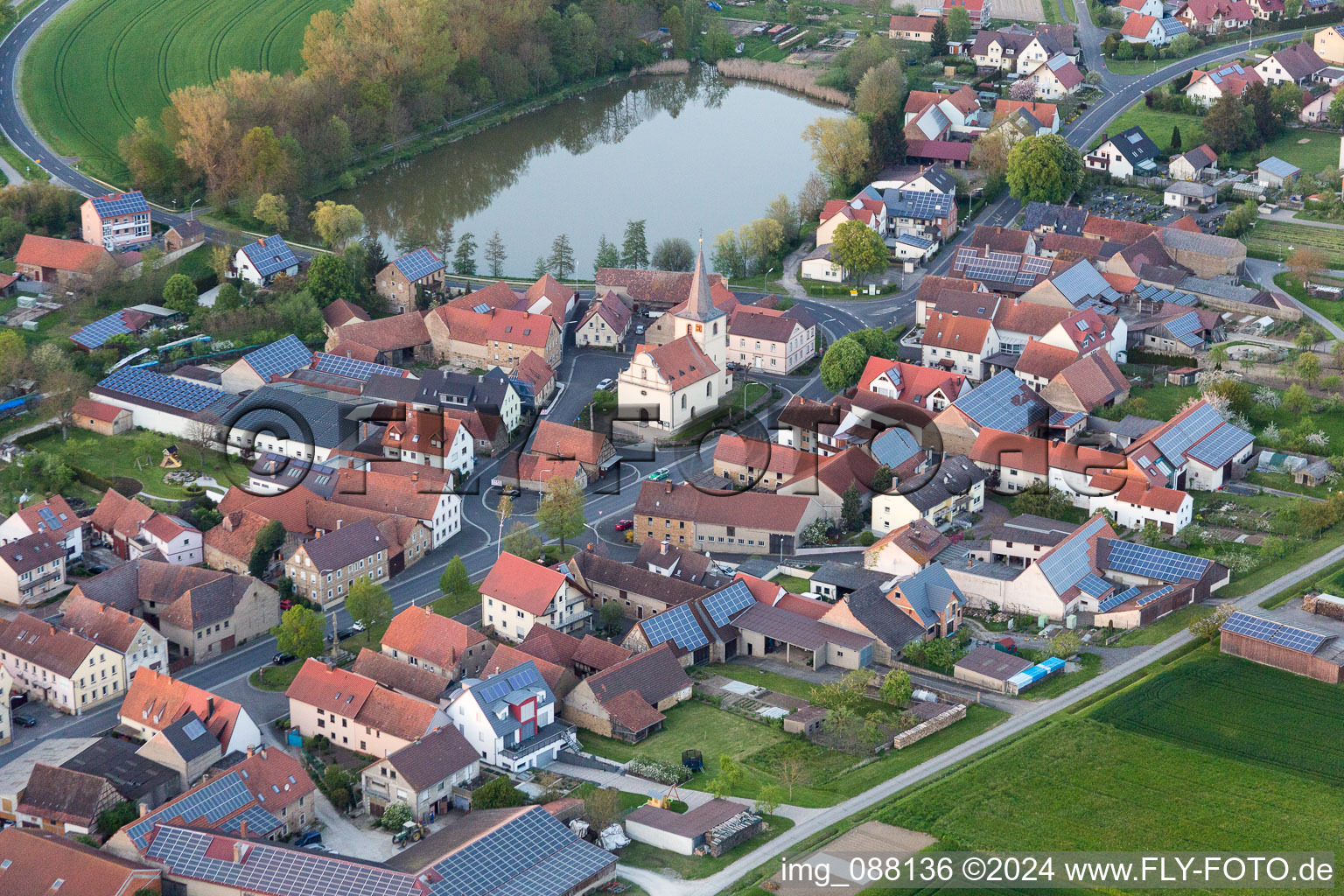 Village on the lake bank areas of Voegniter Sees in the district Moenchstockheim in Sulzheim in the state Bavaria, Germany