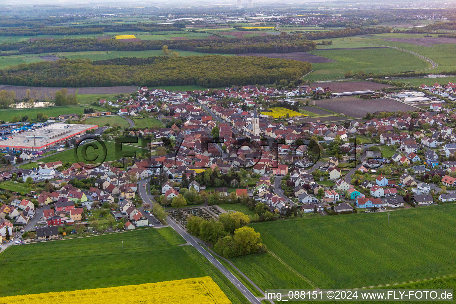 Aerial photograpy of Village - view on the edge of agricultural fields and farmland in Grettstadt in the state Bavaria, Germany