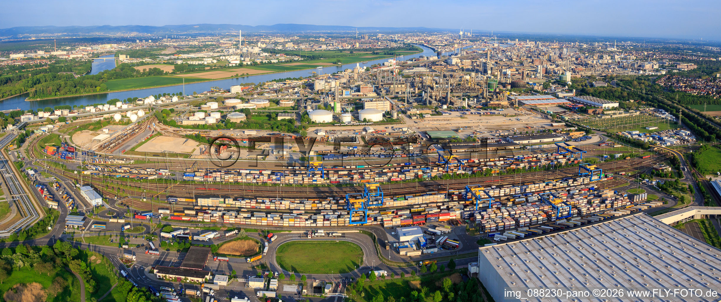 Panoramic view of the chemical plant BASF on the Rhine riverbank from the north, including freight yard and warehouse. in the district BASF in Ludwigshafen am Rhein in the state Rhineland-Palatinate, Germany