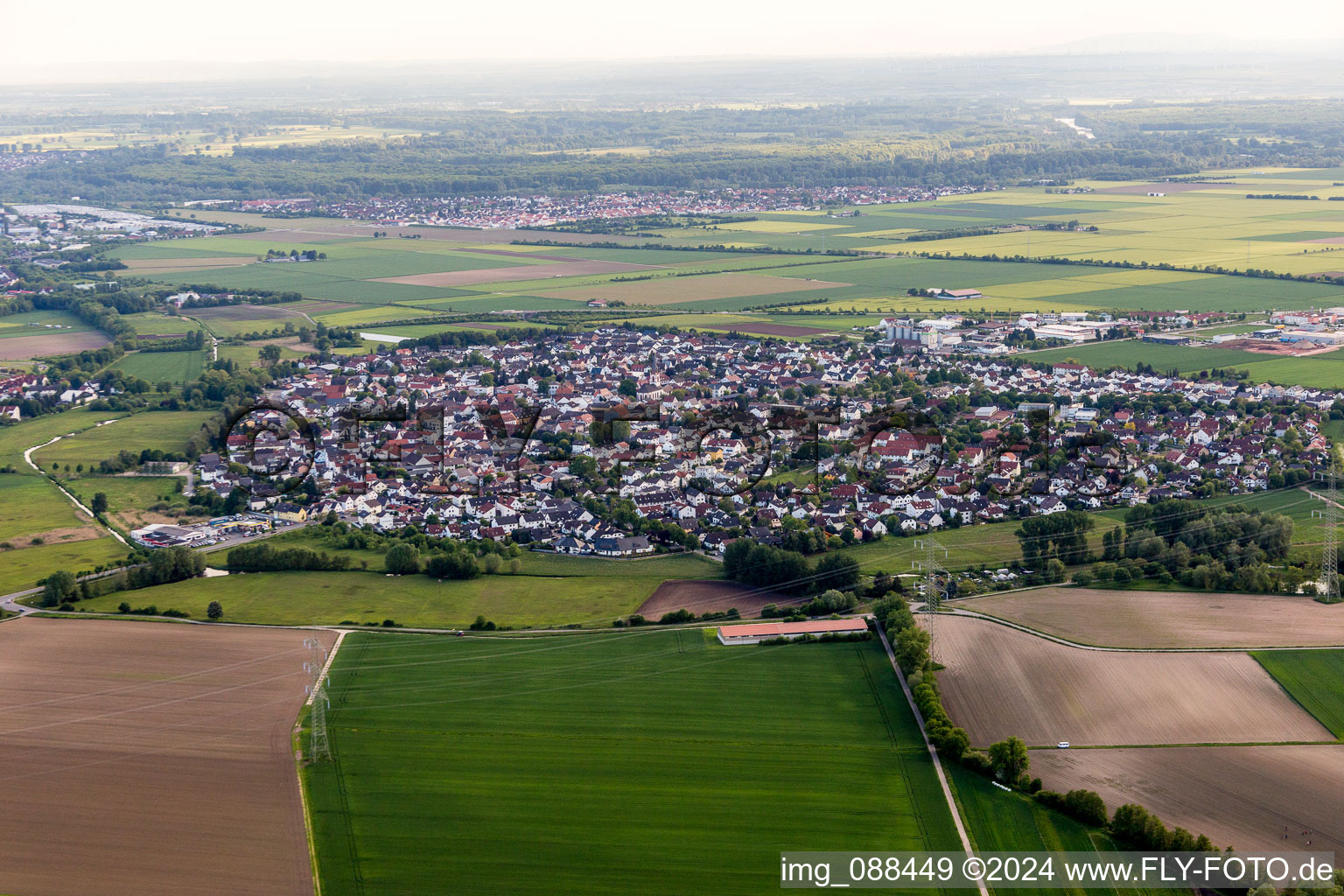 Village - view on the edge of agricultural fields and farmland in Wolfskehlen in the state Hesse, Germany