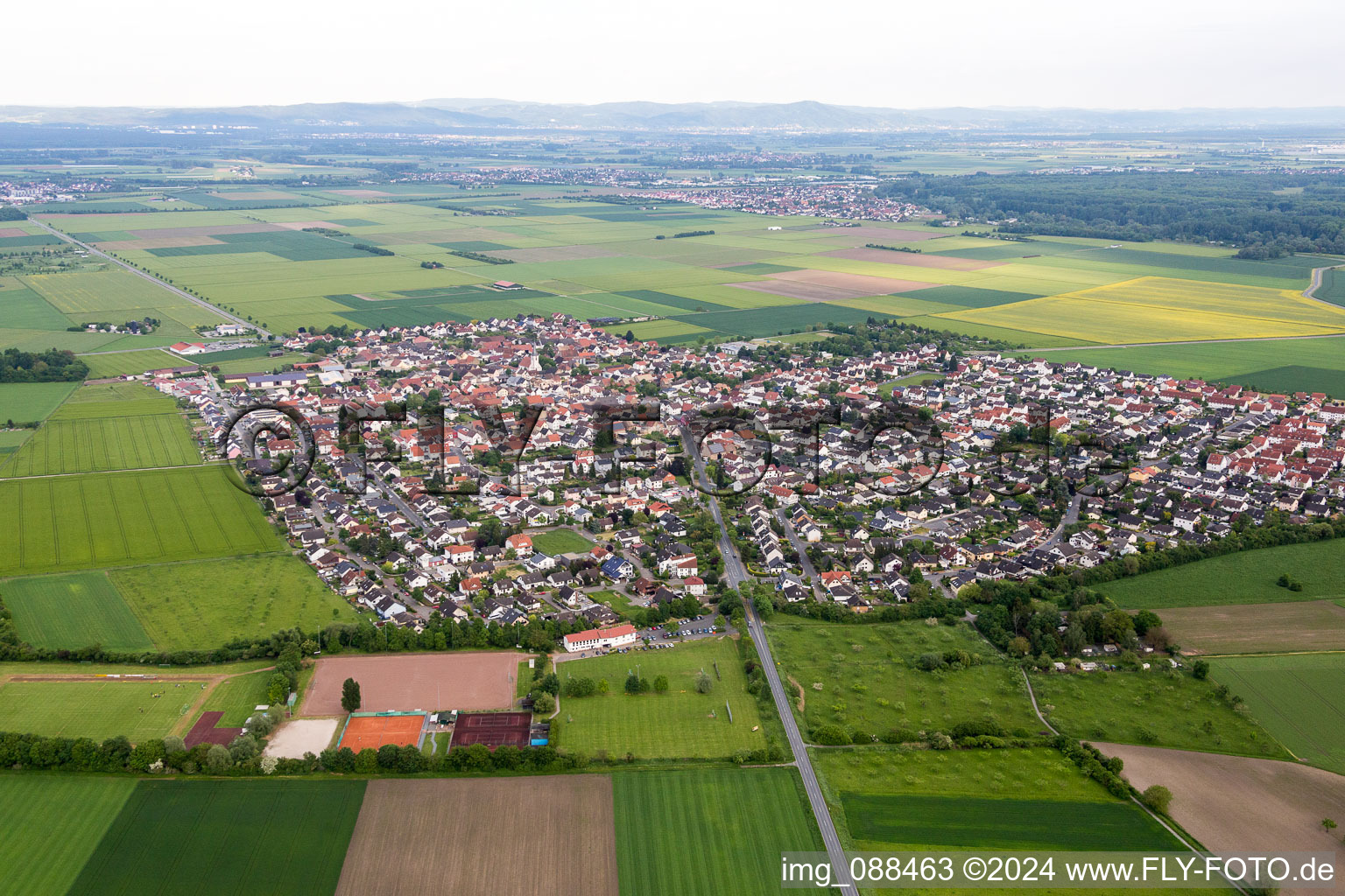 Aerial view of Village - view on the edge of agricultural fields and farmland in the district Leeheim in Riedstadt in the state Hesse, Germany