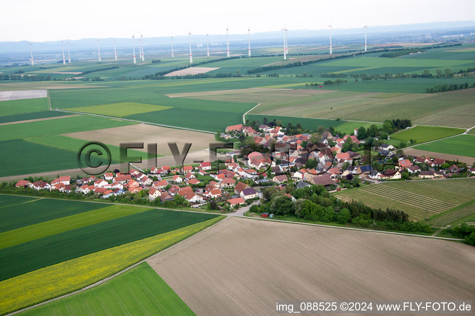 Village - view on the edge of agricultural fields and farmland in Frettenheim in the state Rhineland-Palatinate, Germany