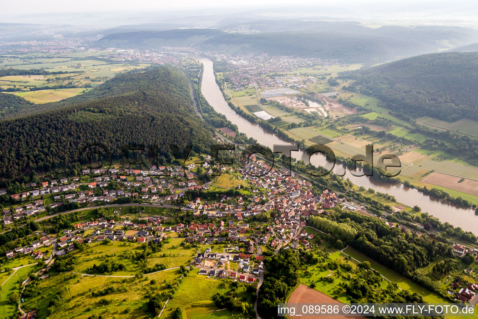 Aerial view of Village on the river bank areas of the Main river in Laudenbach in the state Bavaria, Germany