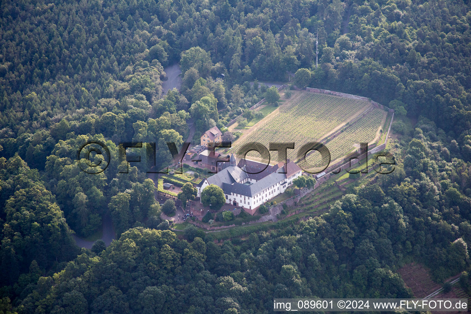 Aerial view of Complex of buildings of the monastery Franziskanerkloster Engelberg in Grossheubach in the state Bavaria, Germany