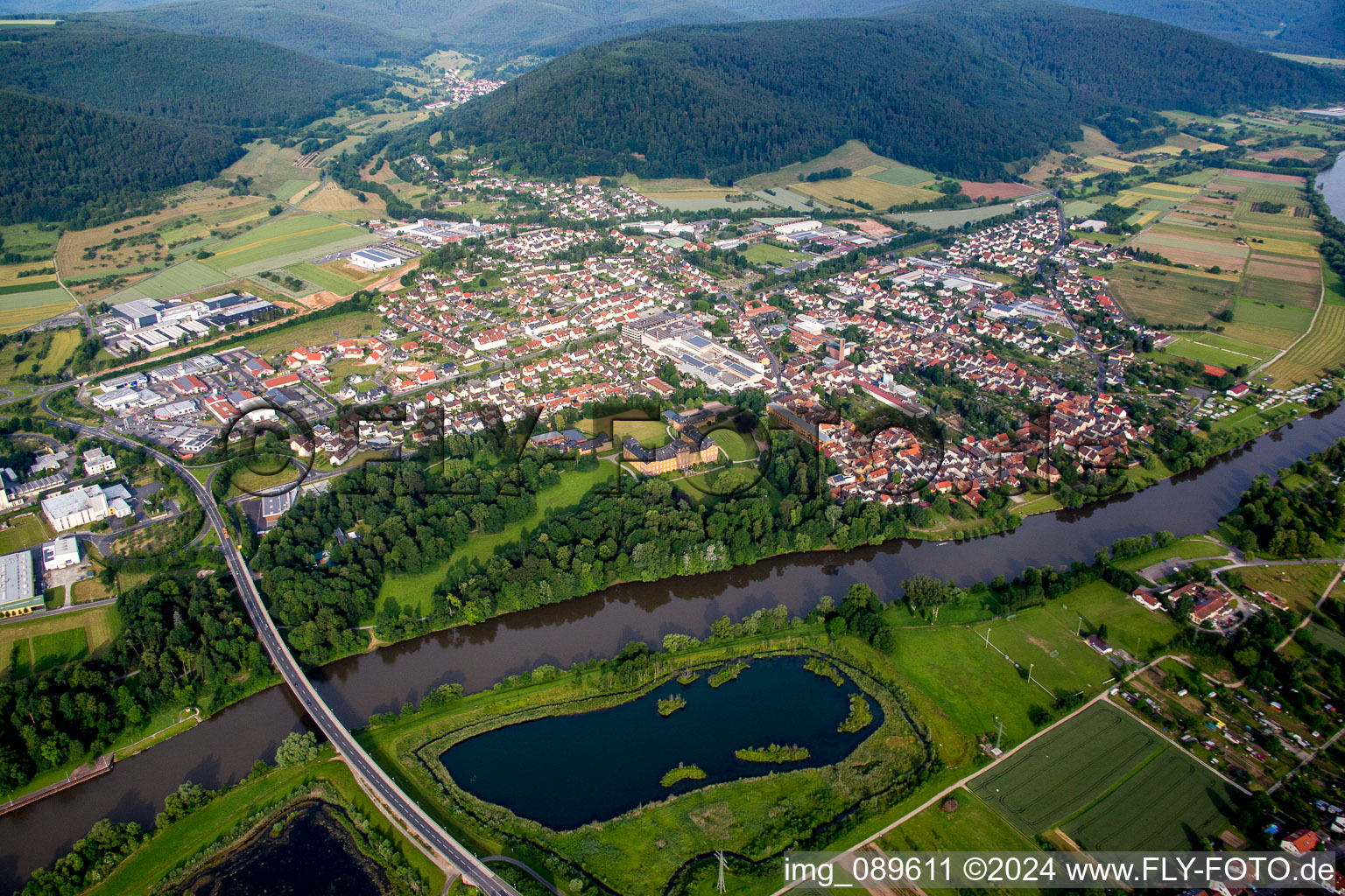 Aerial view of Village on the river bank areas of the Main river in Kleinheubach in the state Bavaria, Germany