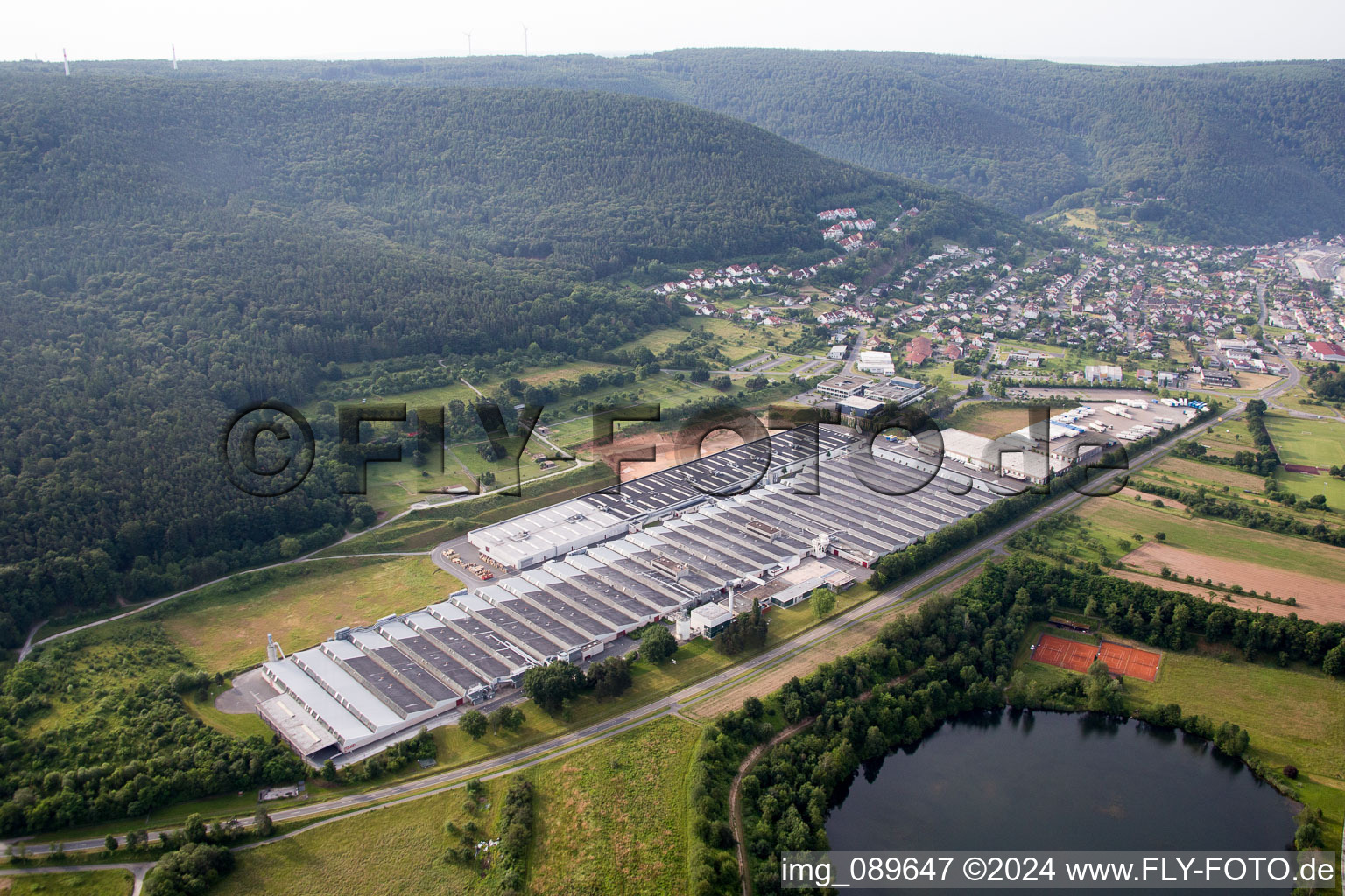 Aerial view of Building and production halls on the premises of Rauch Moebelwerke GmbH in Freudenberg in the state Baden-Wurttemberg, Germany