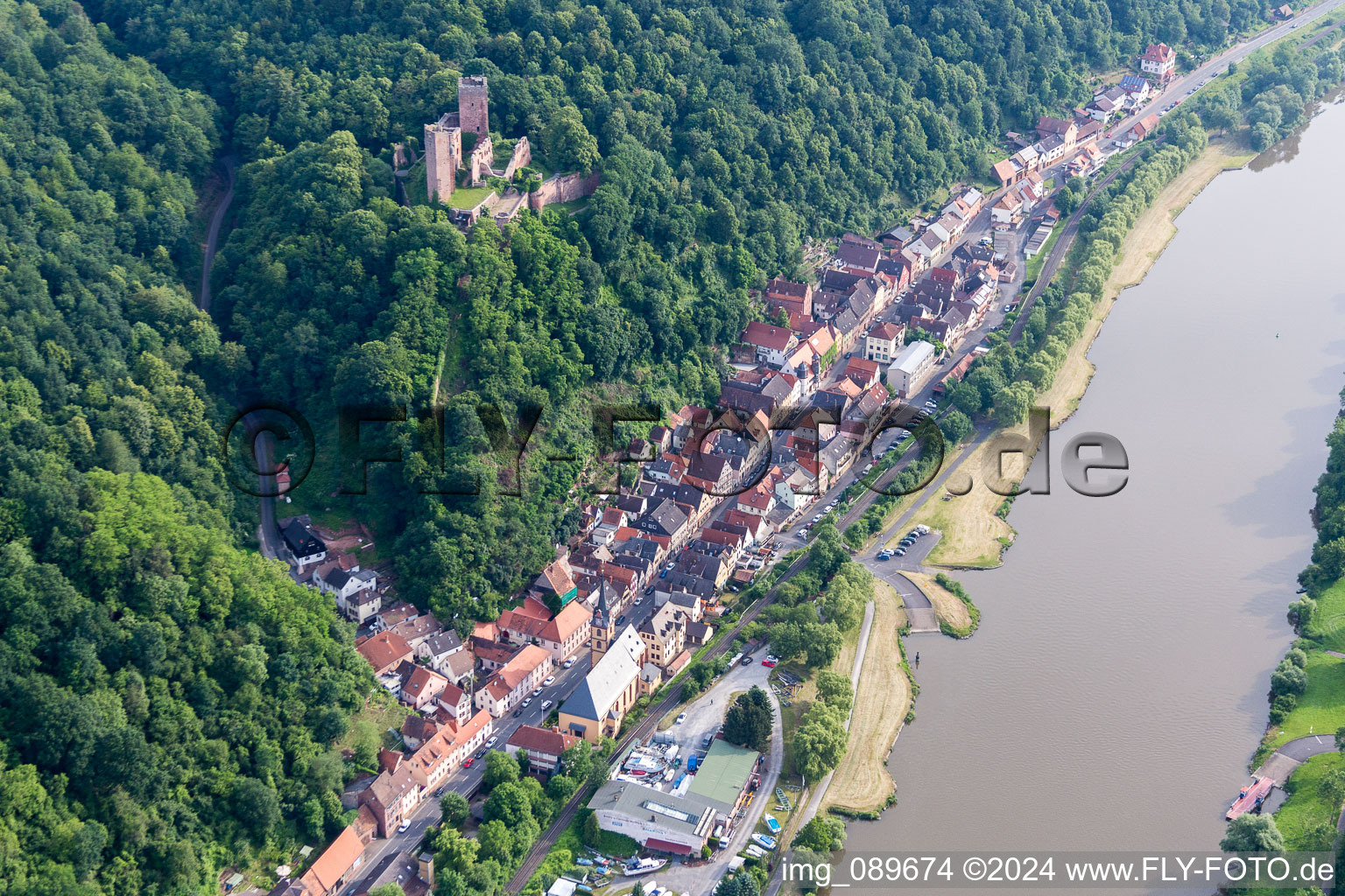 Fortress Henneburg over the Village on the river bank areas of the Main river in Stadtprozelten in the state Bavaria, Germany