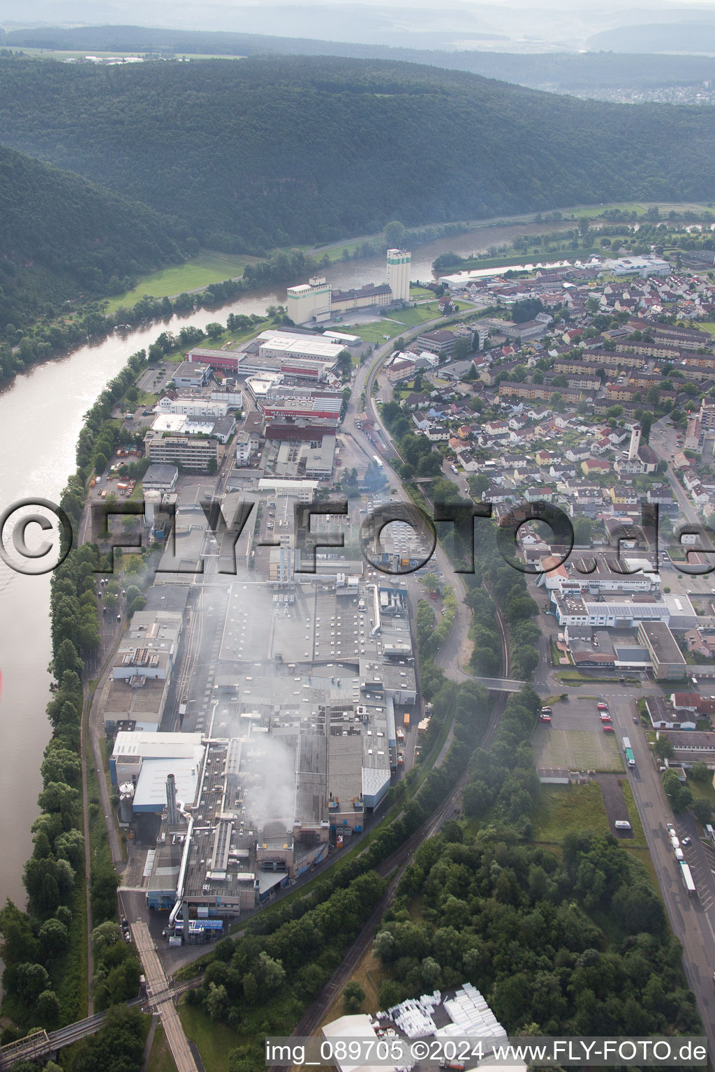 Aerial view of Industrial estate on the river bank areas of the Main river in the district Bestenheid in Wertheim in the state Baden-Wurttemberg, Germany