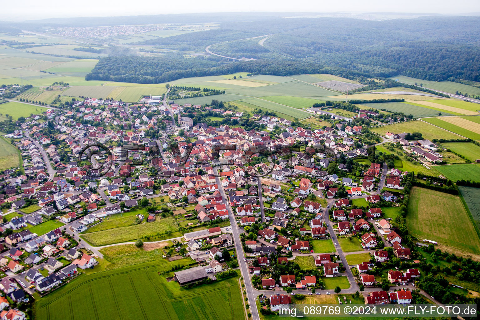 Village - view on the edge of agricultural fields and farmland in Waldbrunn in the state Bavaria, Germany