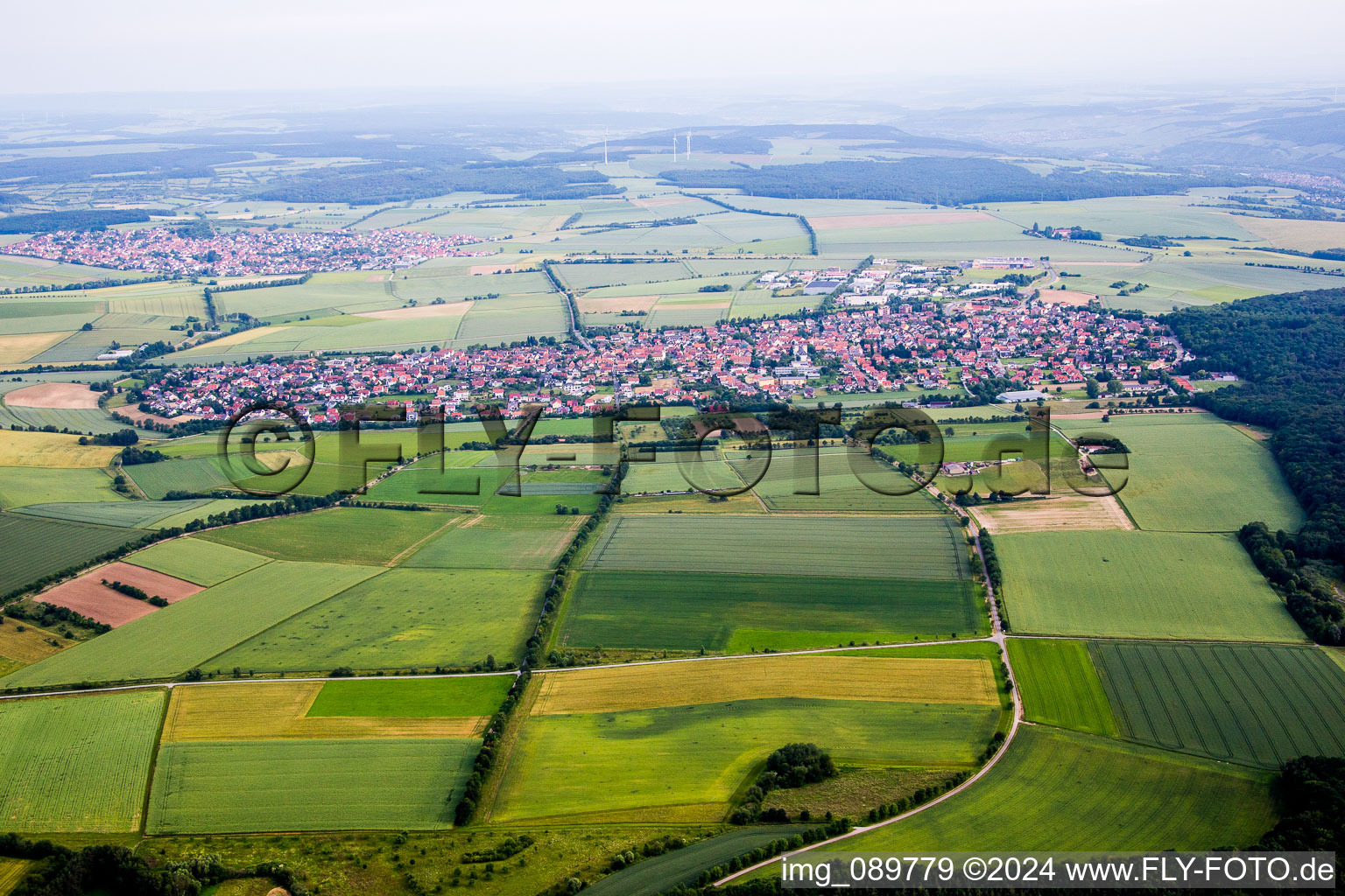 Village - view on the edge of agricultural fields and farmland in Waldbuettelbrunn in the state Bavaria, Germany