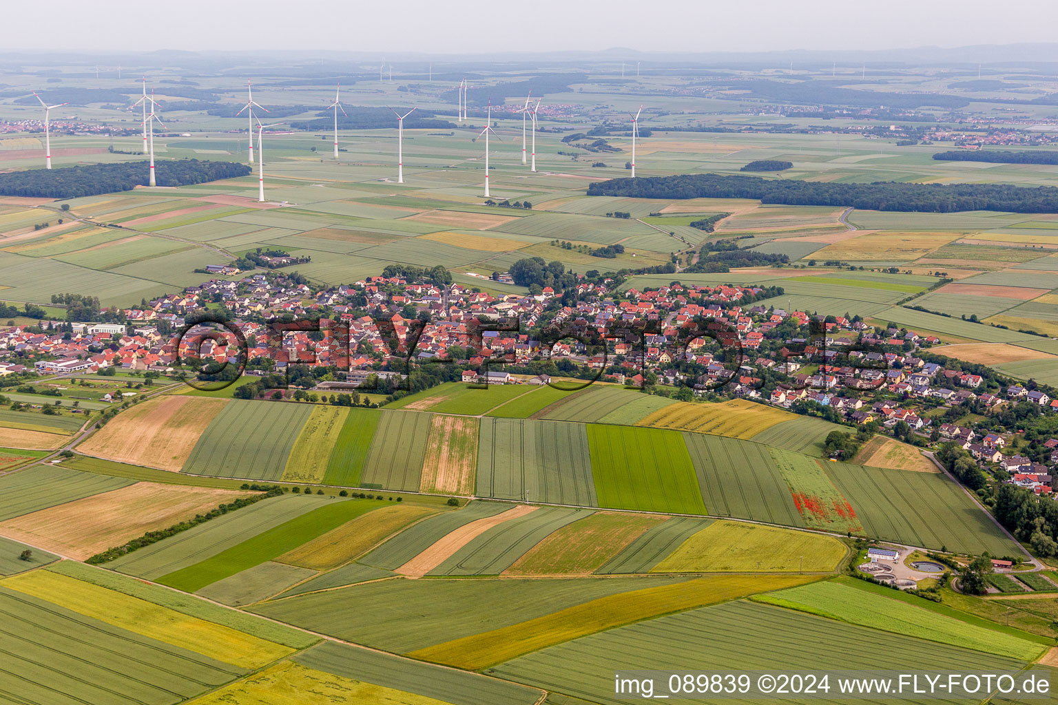 Village - view on the edge of agricultural fields and farmland in Schwanfeld in the state Bavaria, Germany