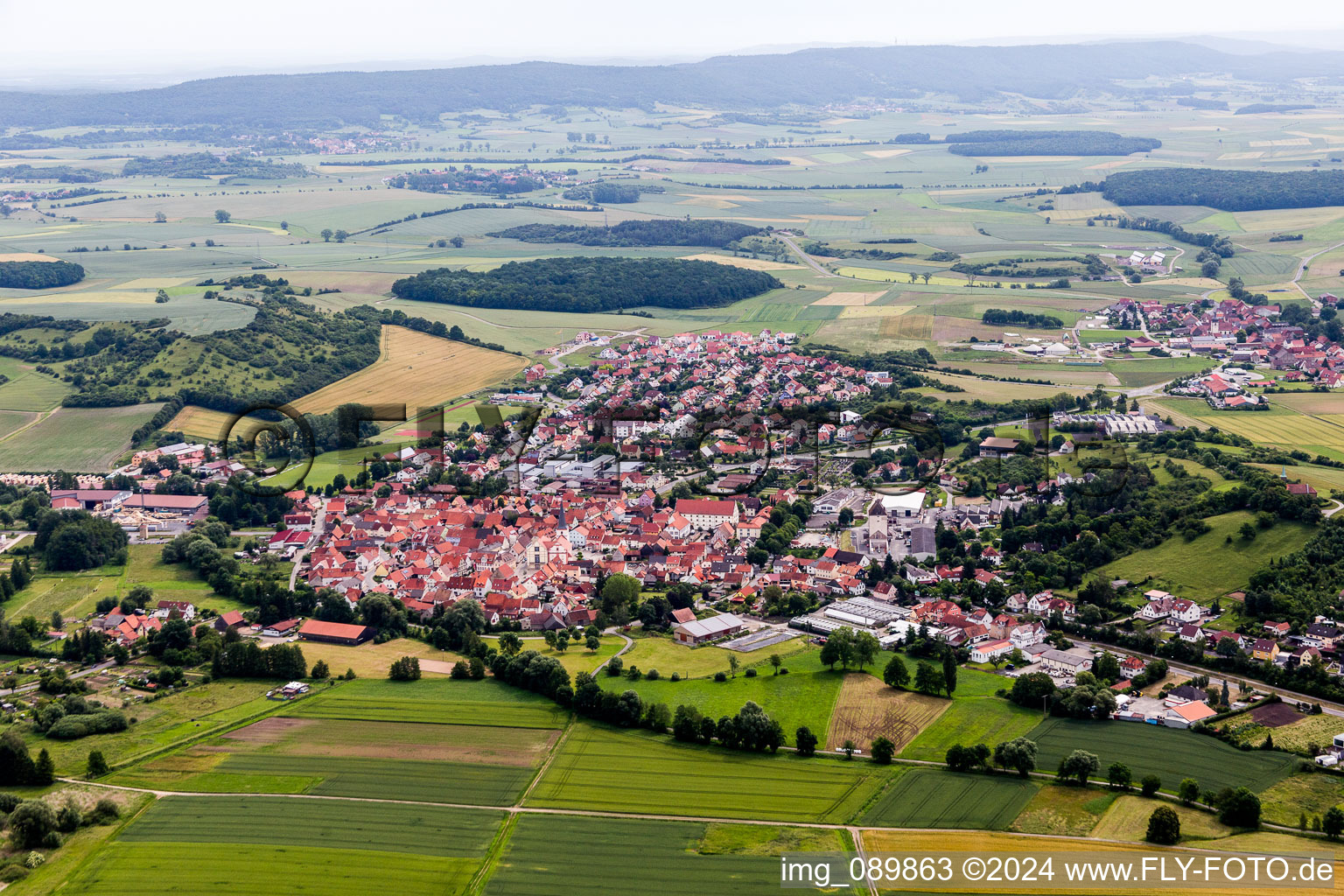 Aerial photograpy of Village - view on the edge of agricultural fields and farmland in the district Rothhausen in Thundorf in Unterfranken in the state Bavaria, Germany