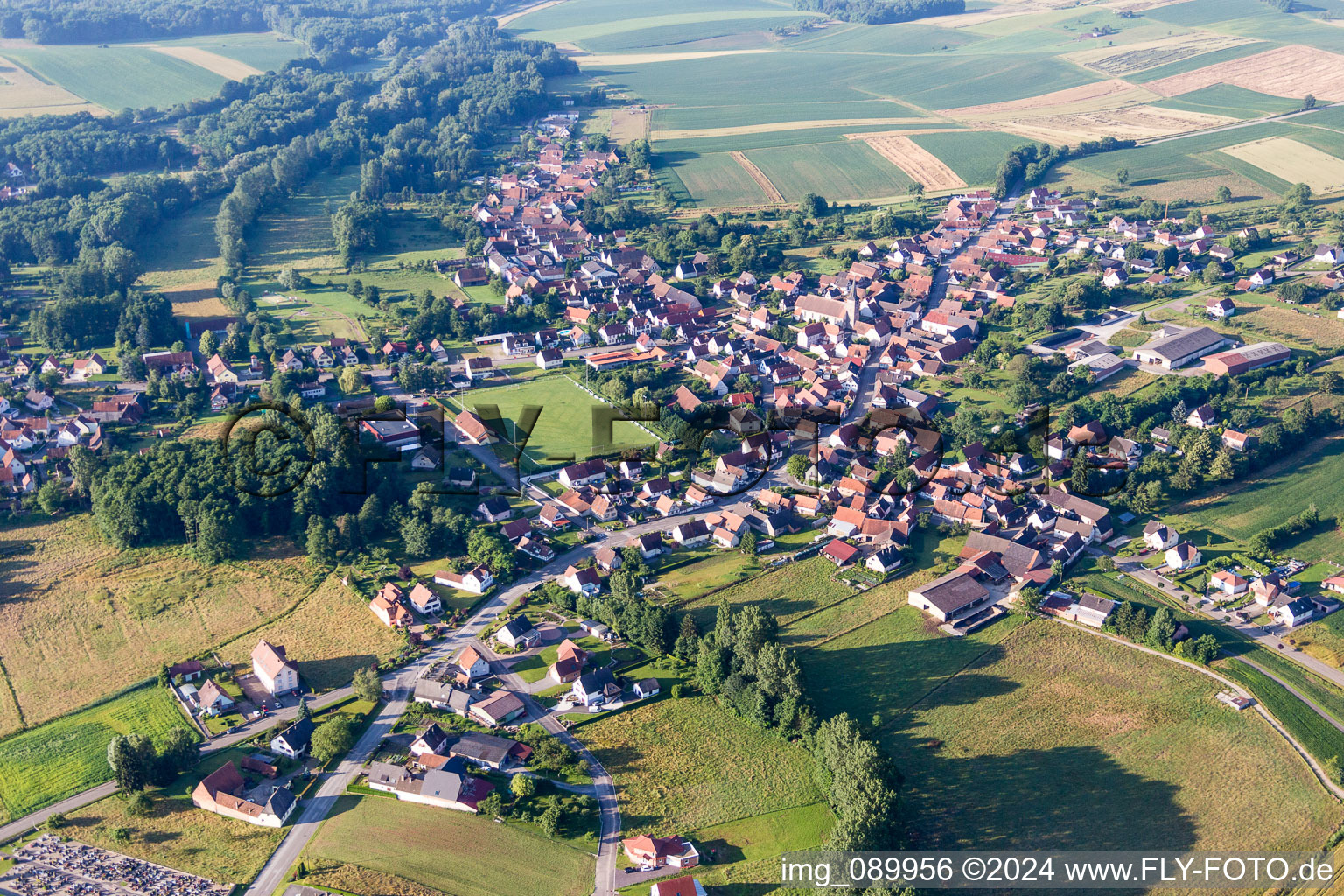 Village - view on the edge of agricultural fields and farmland in Riedseltz in Grand Est, France