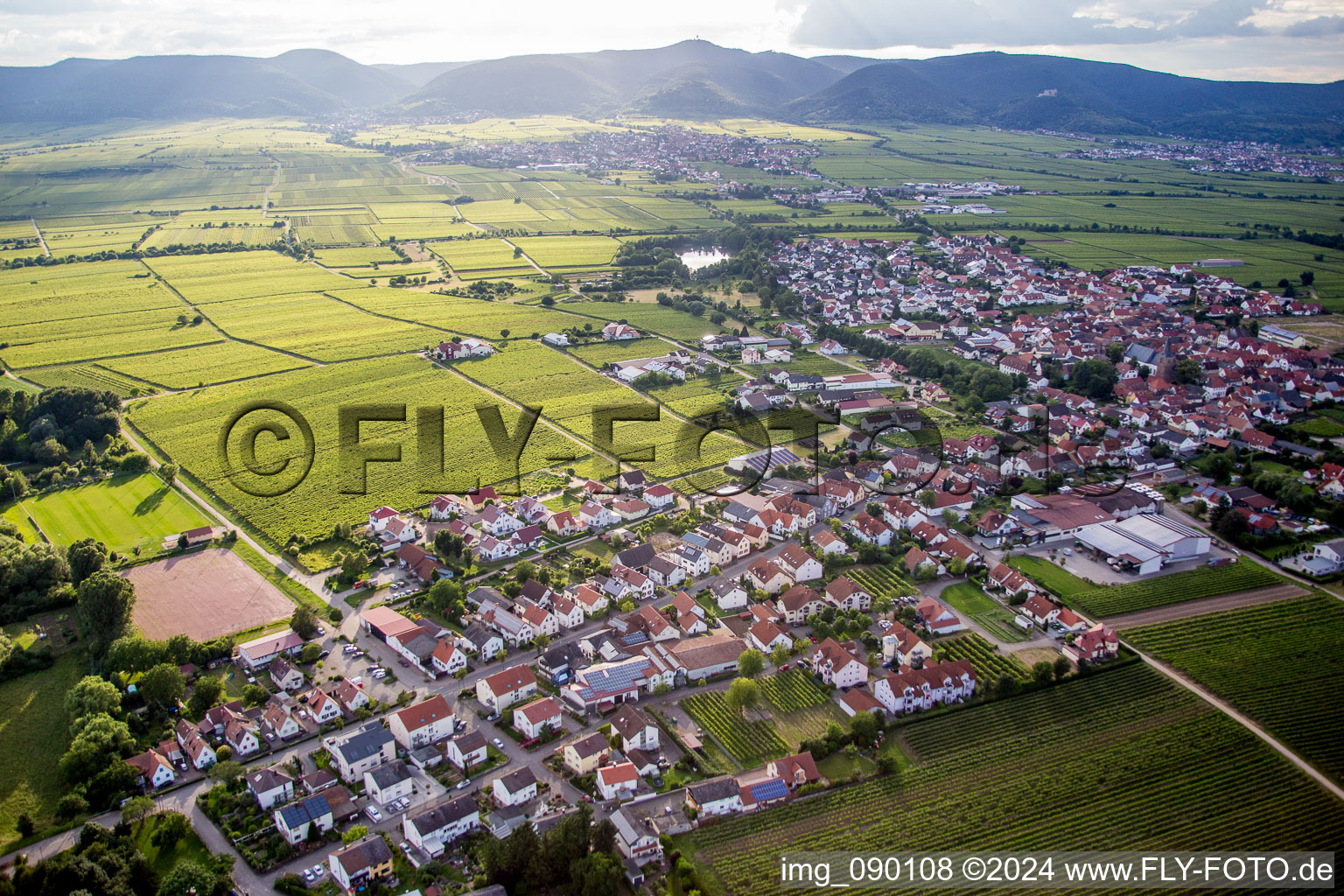 Aerial photograpy of Village - view on the edge of agricultural fields and farmland in Kirrweiler (Pfalz) in the state Rhineland-Palatinate, Germany