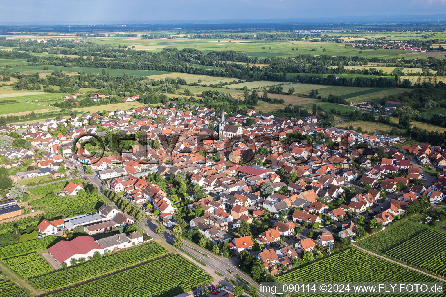 Village - view on the edge of agricultural fields and farmland in Venningen in the state Rhineland-Palatinate, Germany from above