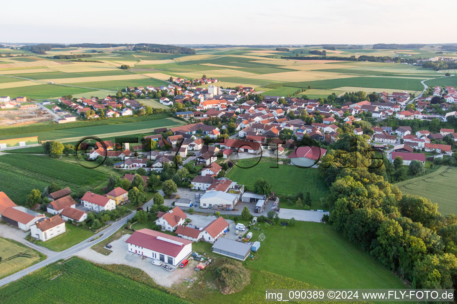 Village - view on the edge of agricultural fields and farmland in Oberpoering in the state Bavaria, Germany