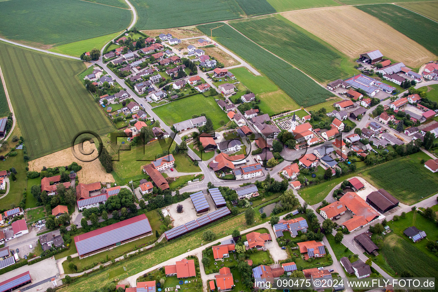 Village - view on the edge of agricultural fields and farmland in the district Kollbach in Gangkofen in the state Bavaria, Germany