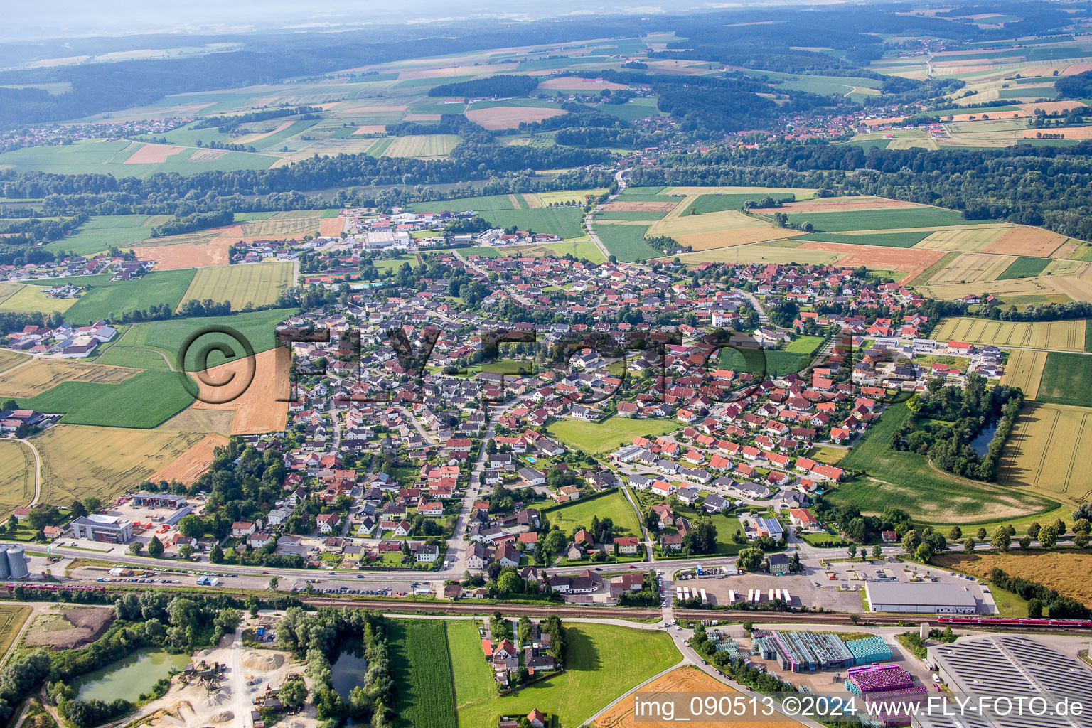 Village - view on the edge of agricultural fields and farmland in the district Kronwieden in Loiching in the state Bavaria, Germany