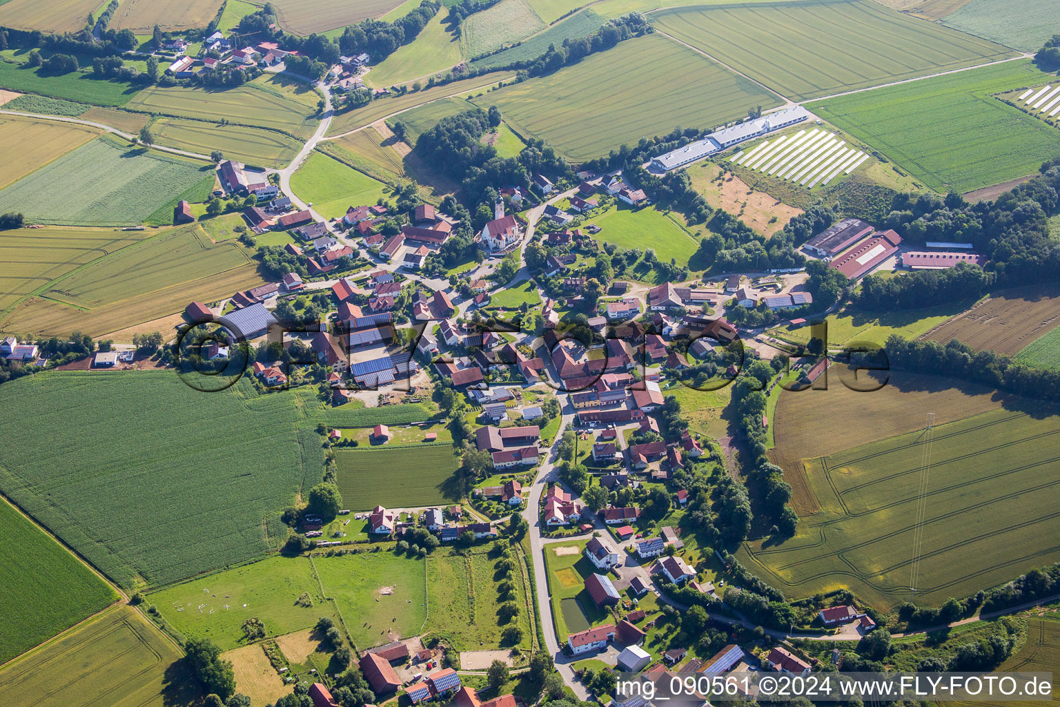 Village - view on the edge of agricultural fields and farmland in the district Hadersbach in Geiselhoering in the state Bavaria, Germany