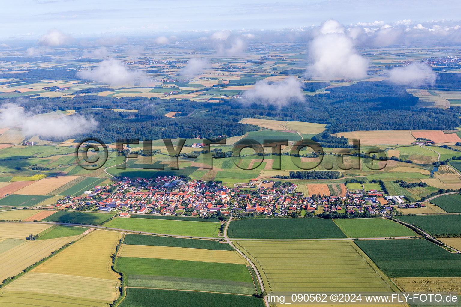 Village - view on the edge of agricultural fields and farmland in Sallach in the state Bavaria, Germany