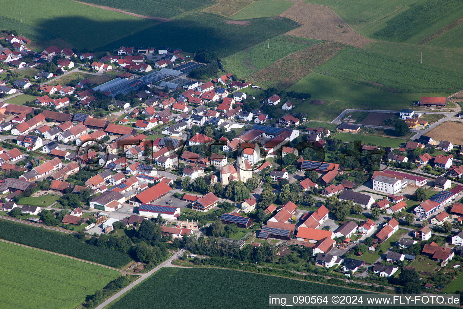 Aerial view of Town View of the streets and houses below clouds of the residential areas in Geiselhoering in the state Bavaria