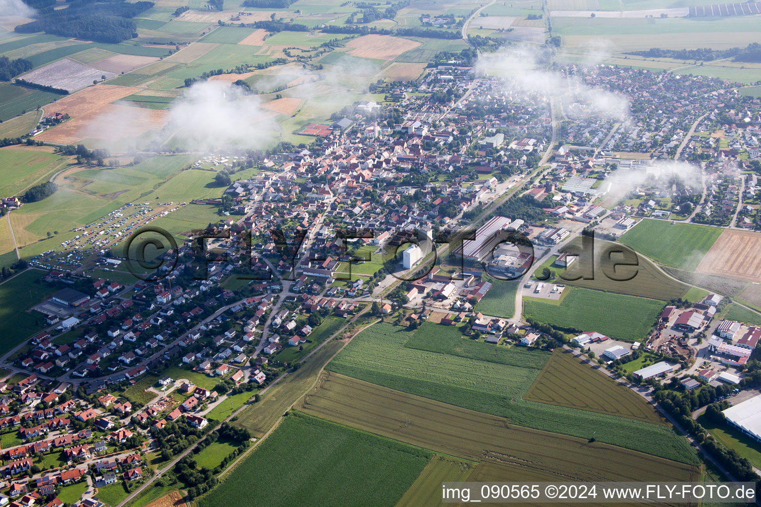 Aerial photograpy of Town View of the streets and houses below clouds of the residential areas in Geiselhoering in the state Bavaria