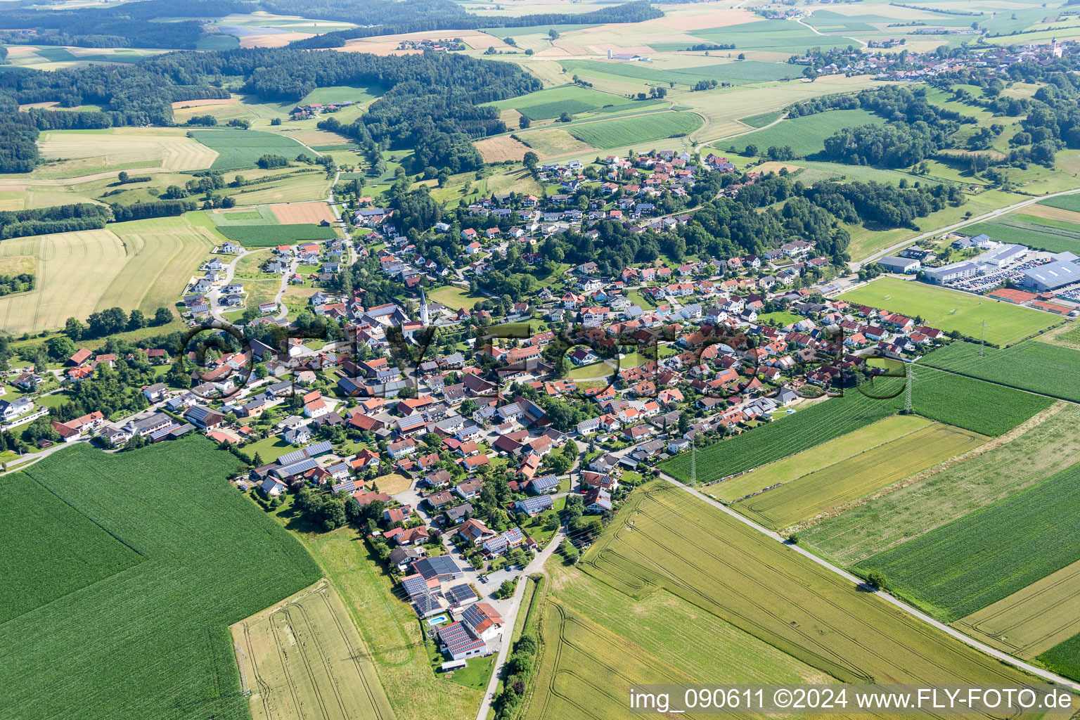 Village - view on the edge of agricultural fields and farmland in Moosthenning in the state Bavaria, Germany