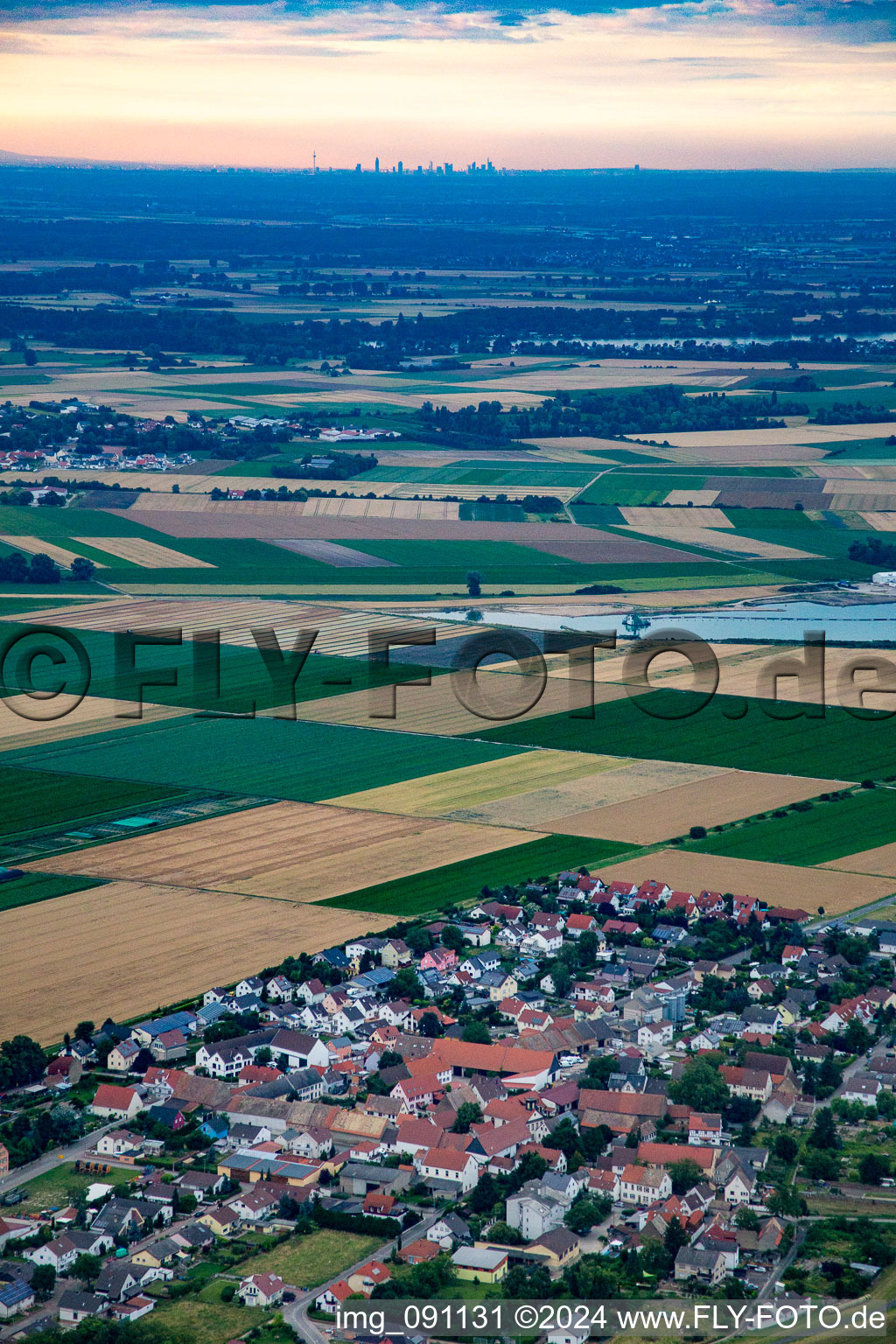 Village - view on the edge of agricultural fields and farmland in the district Ibersheim in Worms in the state Rhineland-Palatinate, Germany