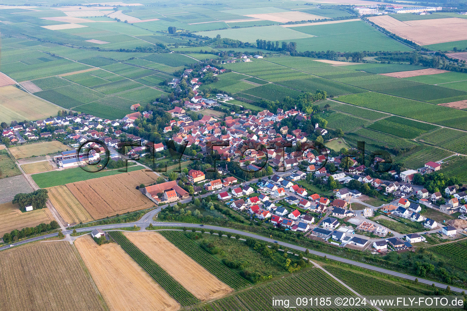 Village - view on the edge of agricultural fields and farmland in Hohen-Suelzen in the state Rhineland-Palatinate, Germany